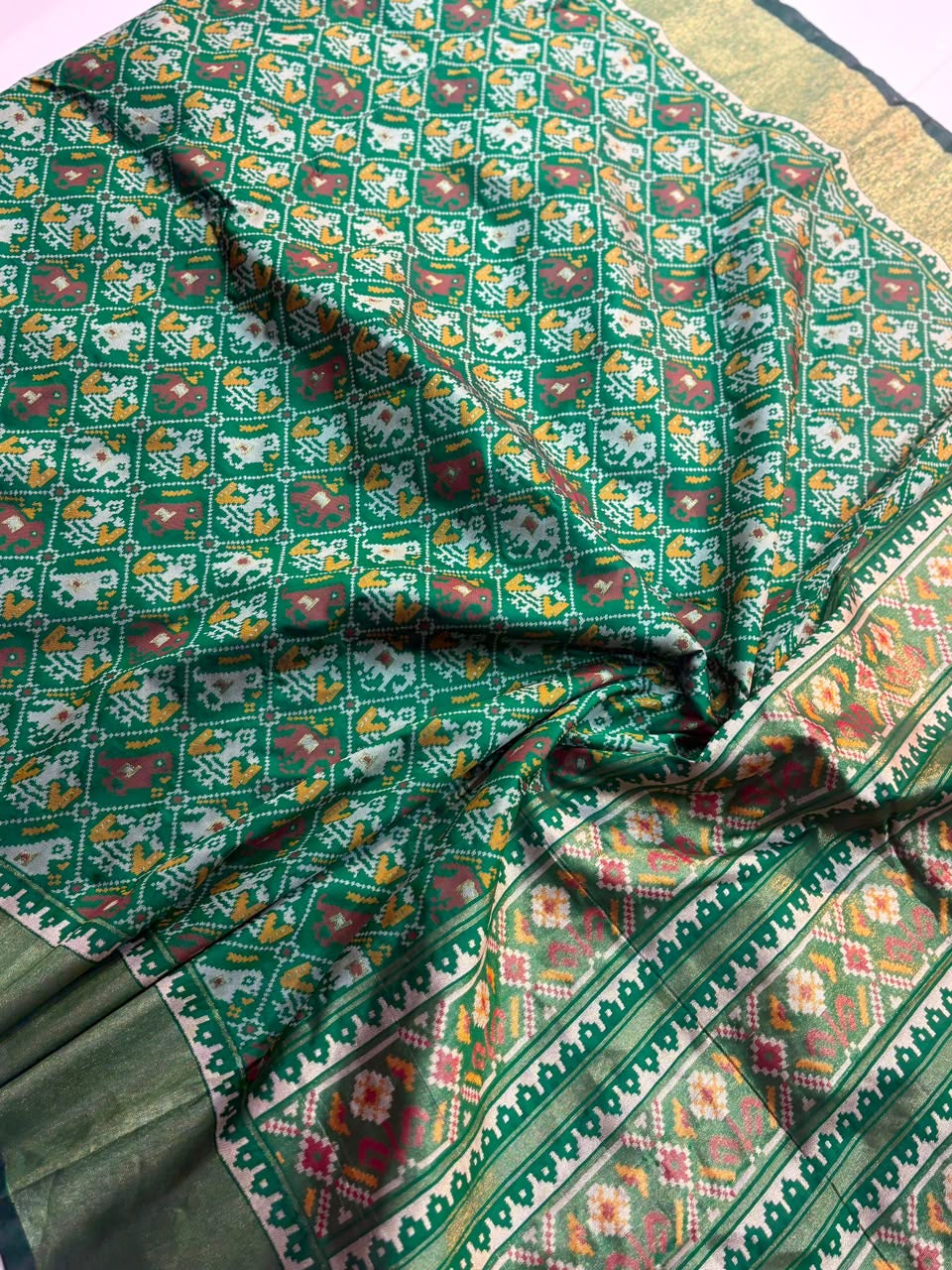 Semi patan patola ikkat silk sarees with tissue borders