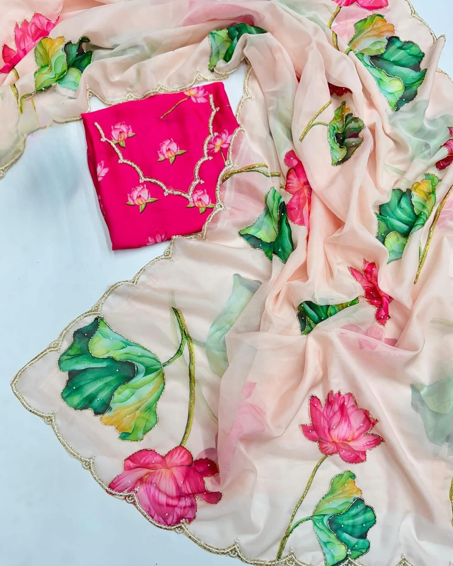 Floral soft and falling organza saree with handwork scalloped borders and rich blouse