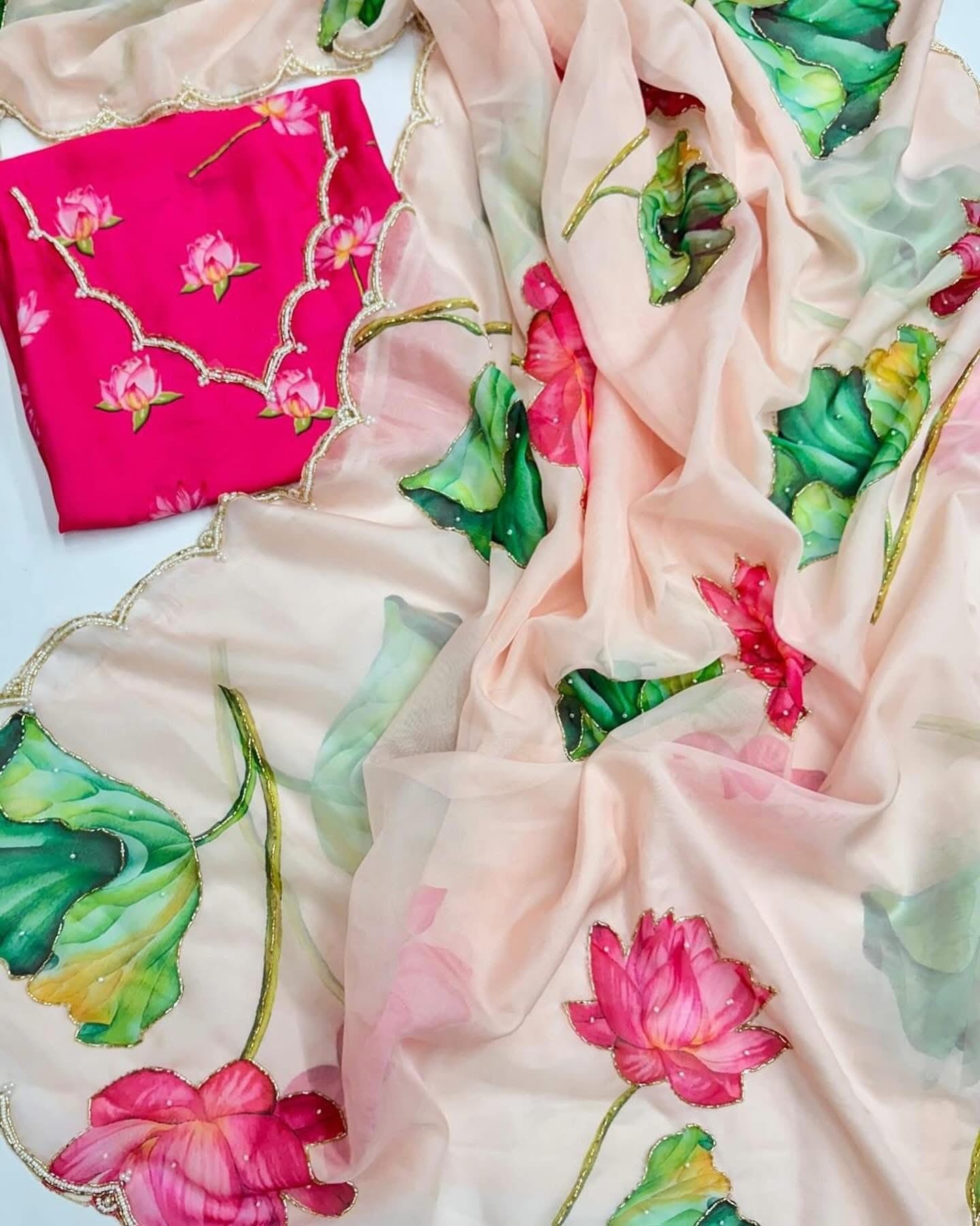 Floral soft and falling organza saree with handwork scalloped borders and rich blouse