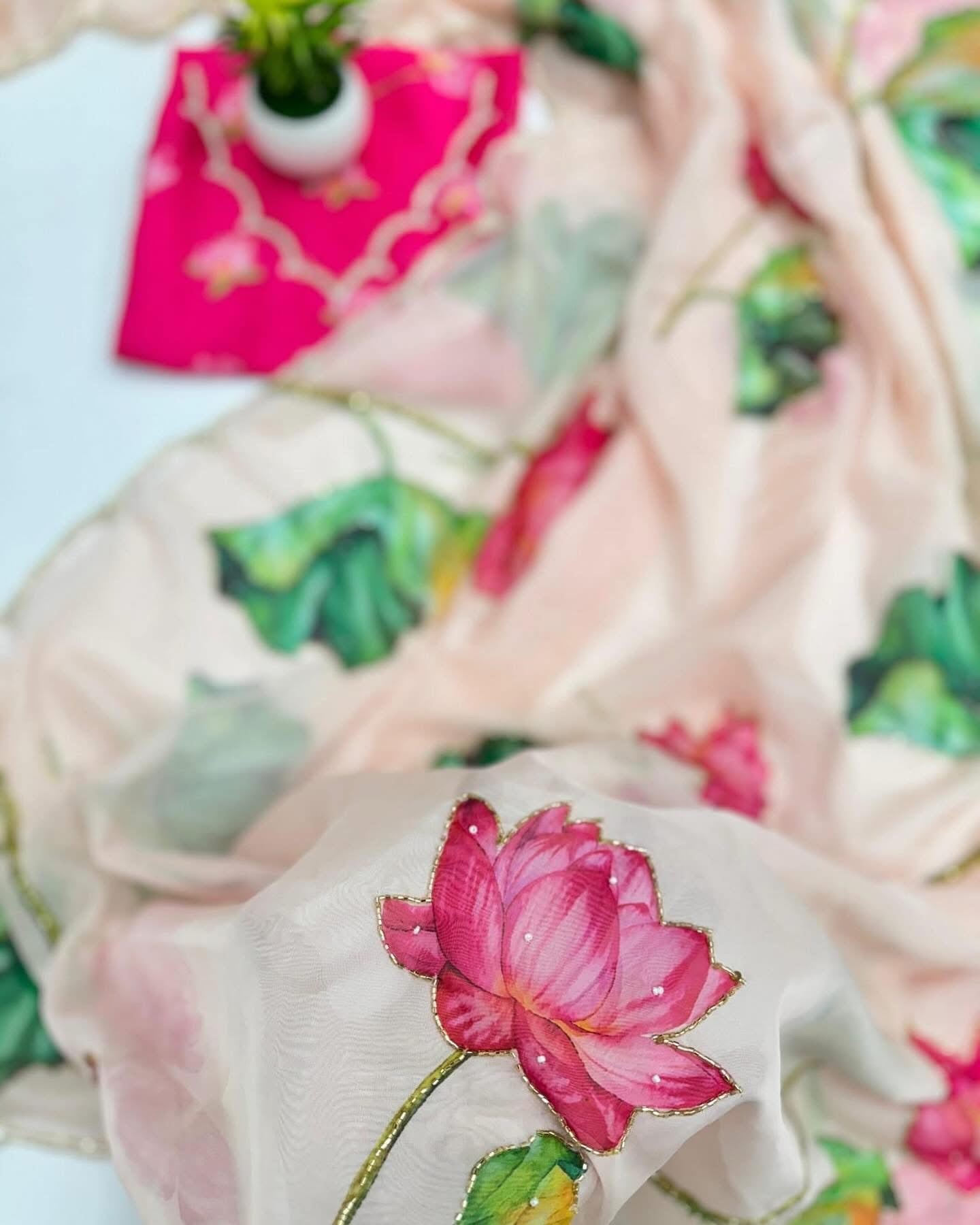 Floral soft and falling organza saree with handwork scalloped borders and rich blouse