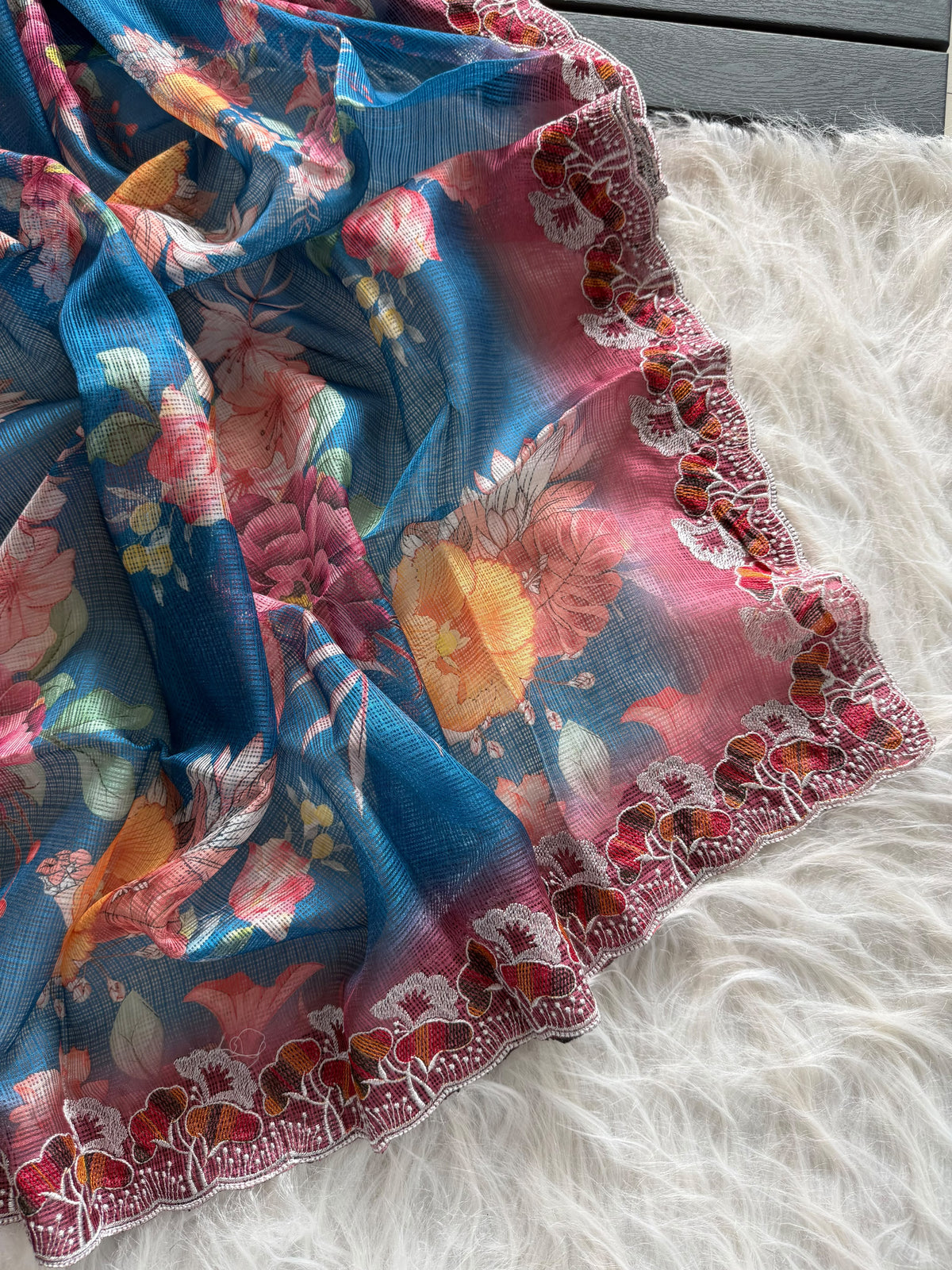 Floral kota sarees with scalloped intricate embroidery and unstitched blouse